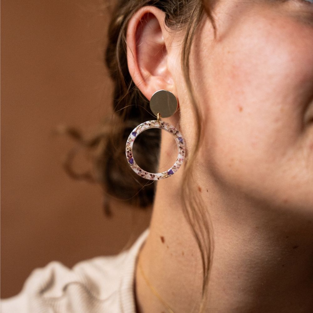 Bezel: Solid resin Disc: Gold plated brass Stud: Sterling Silver Inlay: A mix of Pink Ericas and Sea Lavender