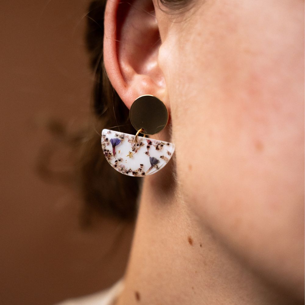 Botanical resin drop earrings with pink erica and sea lavender, gold plated brass disc studs and sterling silver posts.