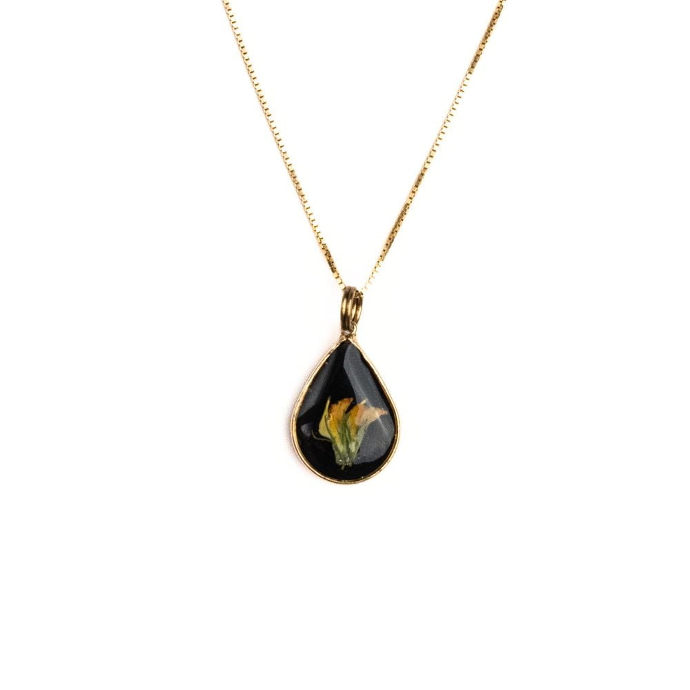 Gold teardrop pendant necklace with real wild pea flower from Cape Town set in resin on a gold plated sterling silver chain.