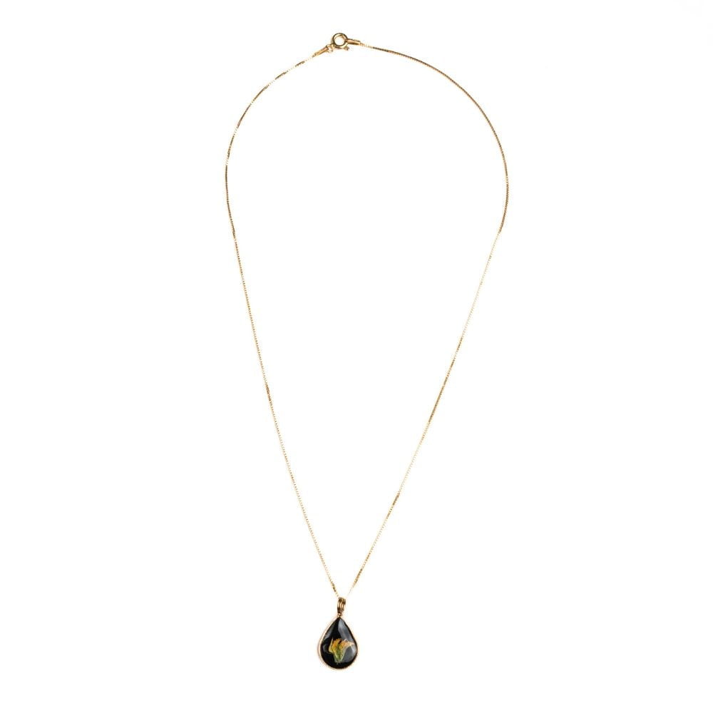 Gold teardrop pendant necklace with real wild pea flower from Cape Town set in resin on a gold plated sterling silver chain.