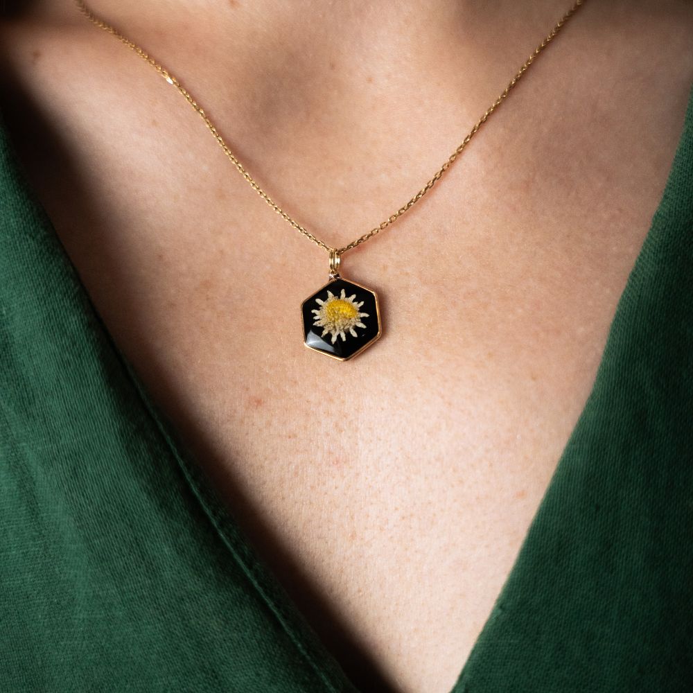 Gold hexagon daisy necklace with real Cape Town daisy flower set in resin on a gold plated sterling silver chain.