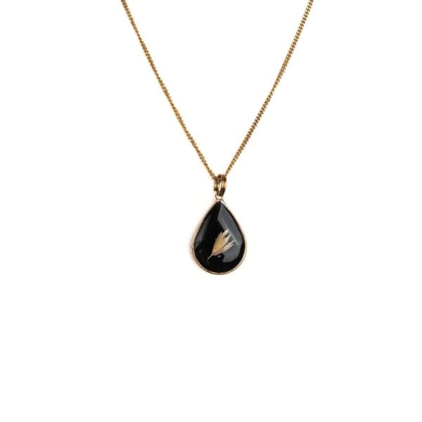 Gold teardrop pendant necklace with real Cape Town grass seeds set in resin on a gold plated sterling silver chain.