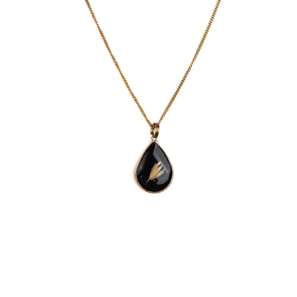 Gold teardrop pendant necklace with real Cape Town grass seeds set in resin on a gold plated sterling silver chain.