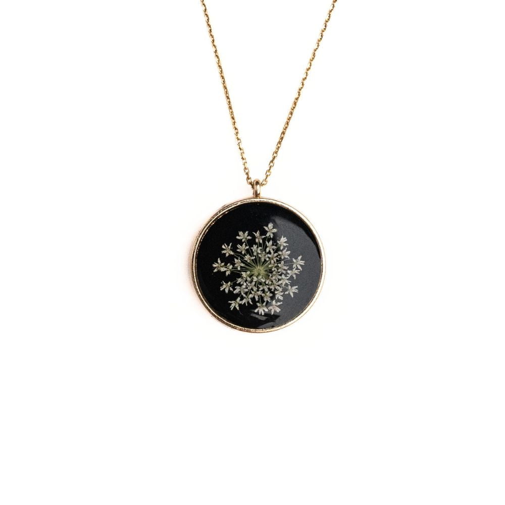 Gold round pendant necklace with real wild lace flowers from Germany set in resin on a gold plated sterling silver chain.