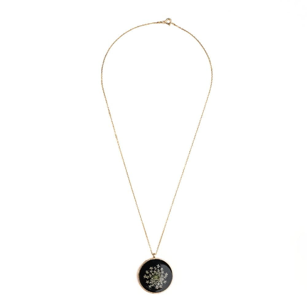 Gold round pendant necklace with real wild lace flowers from Germany set in resin on a gold plated sterling silver chain.