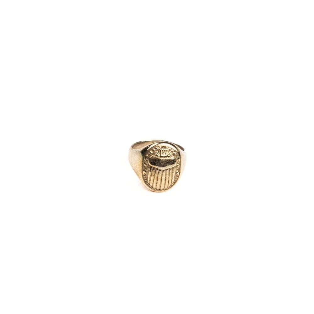 Solid brass scarab signet ring with engraved beetle detail.