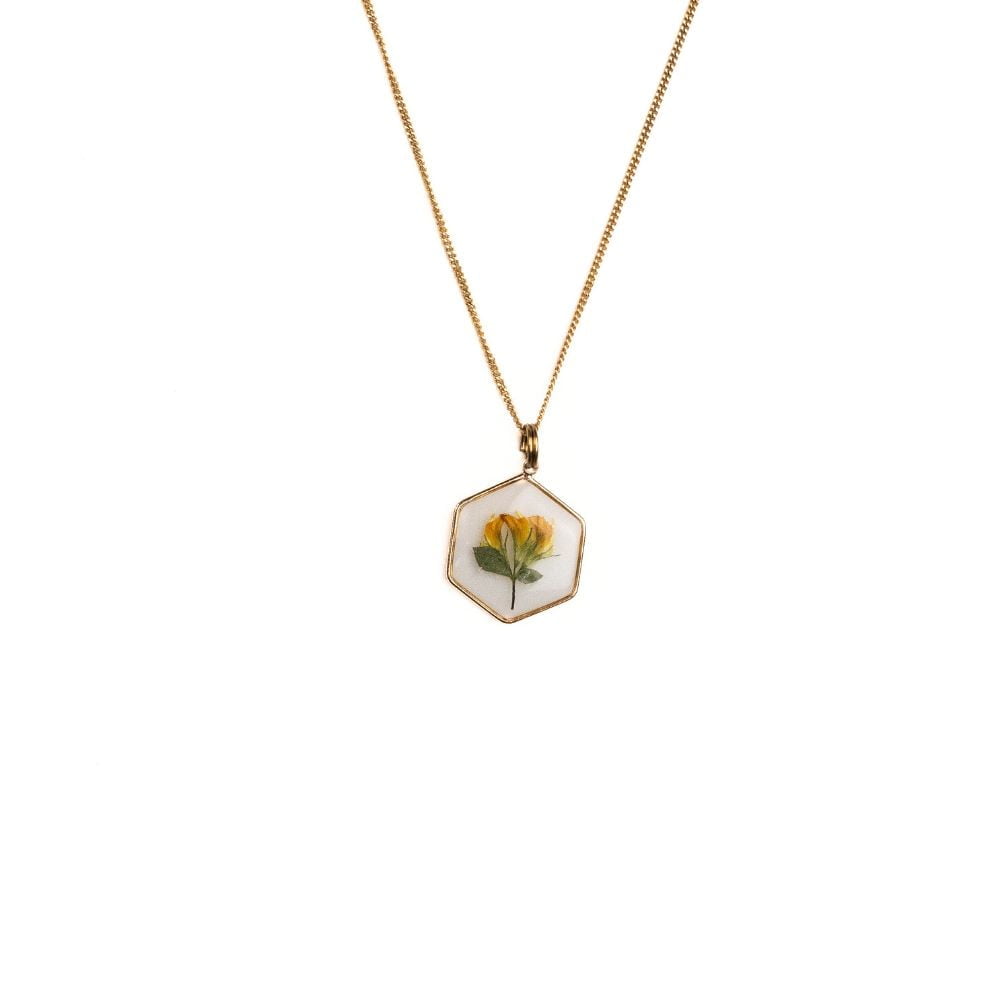 Hexagon gold plated necklace with real wild pea flower preserved in resin.