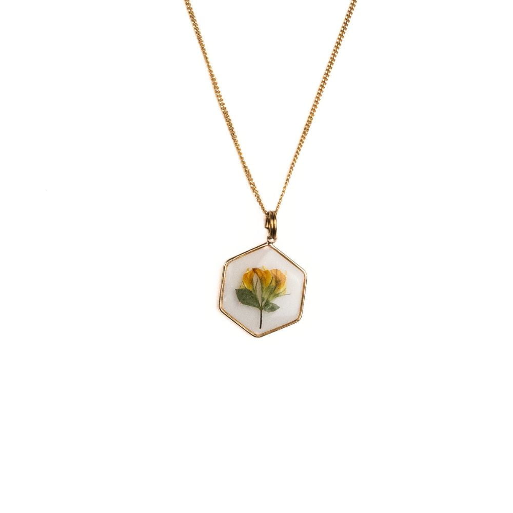 Hexagon gold plated necklace with real wild pea flower preserved in resin.