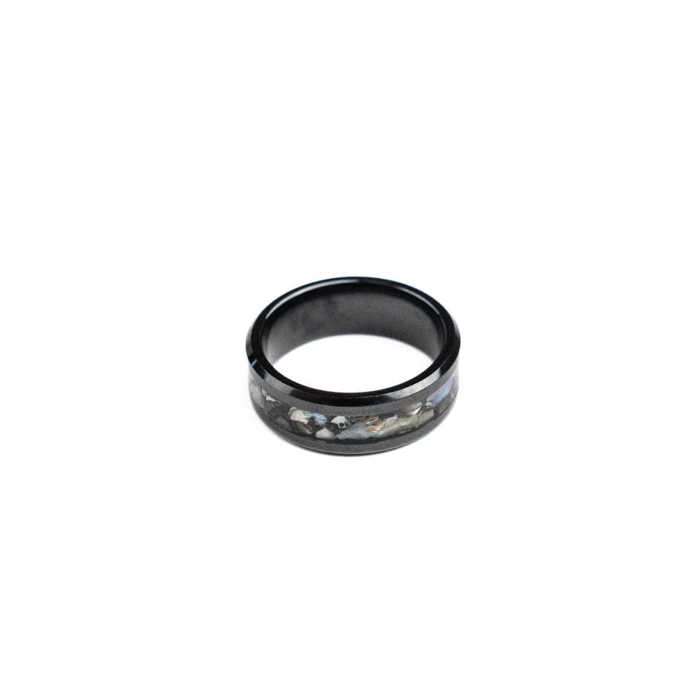 Black ceramic ring featuring a mother of pearl inlay with natural iridescent tones.
