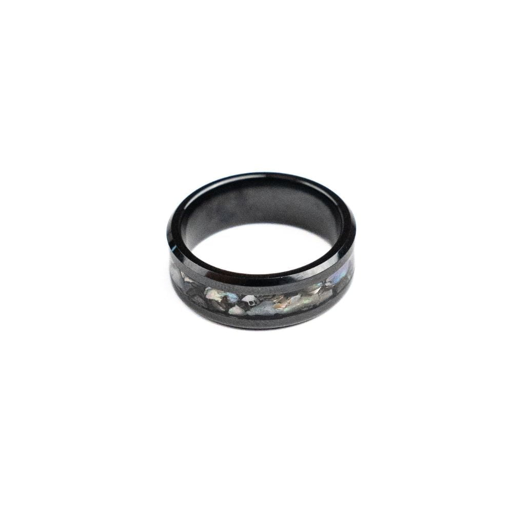 Black ceramic ring featuring a mother of pearl inlay with natural iridescent tones.