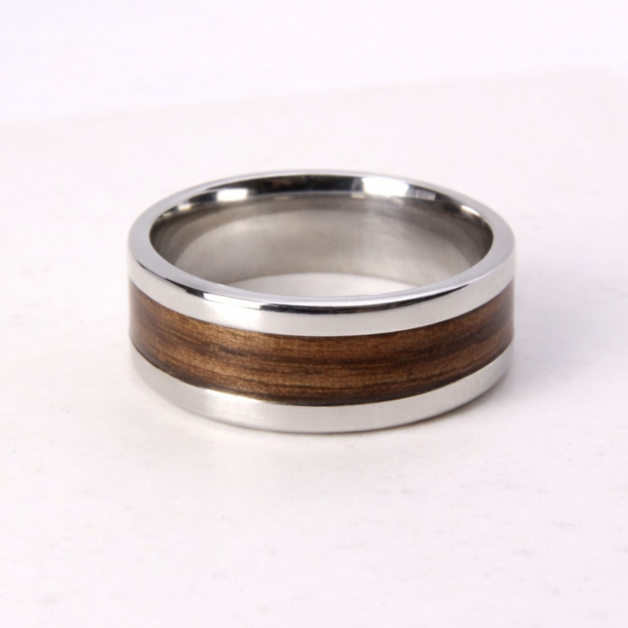 Stainless steel ring with zebrano wood inlay.