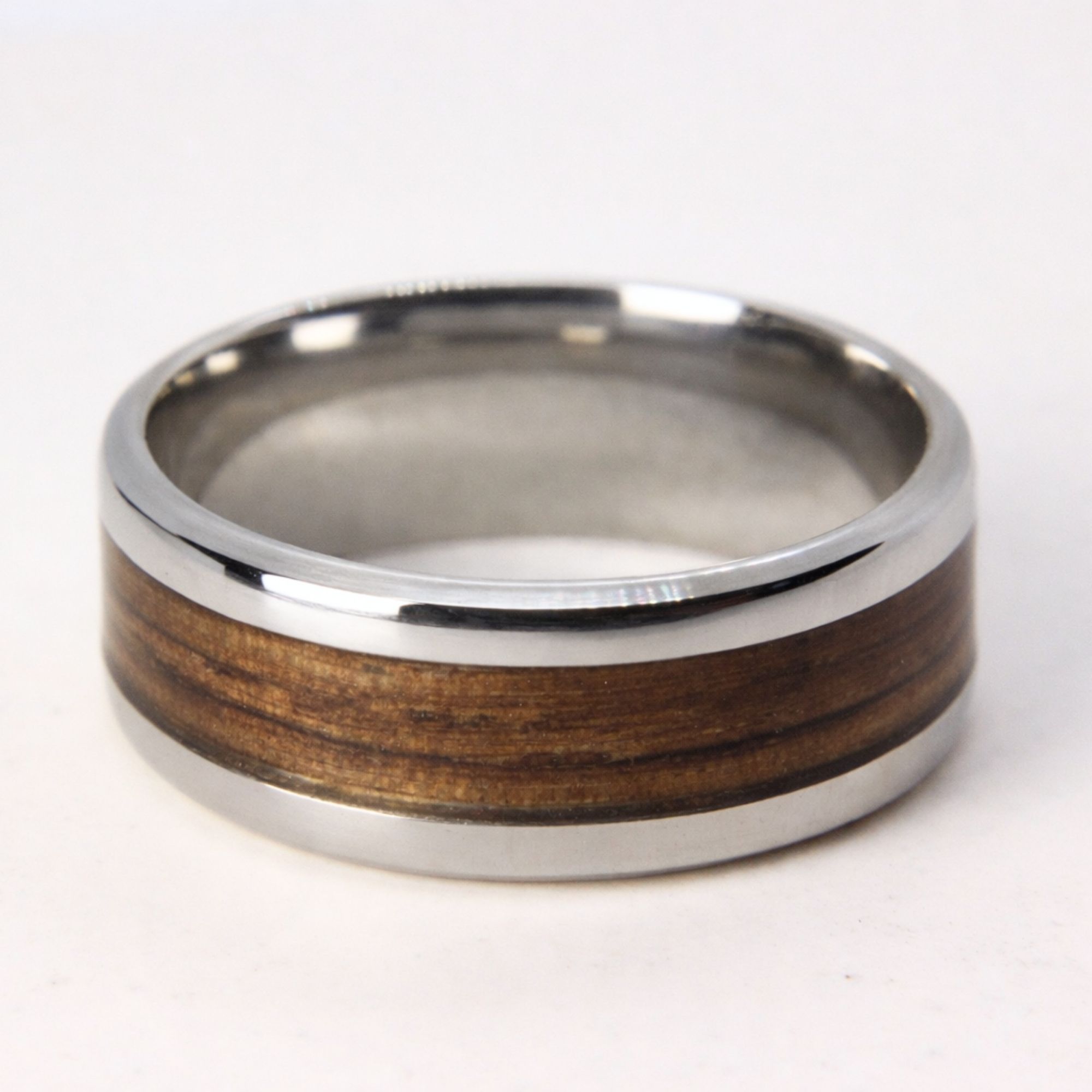 Stainless steel ring with zebrano wood inlay.