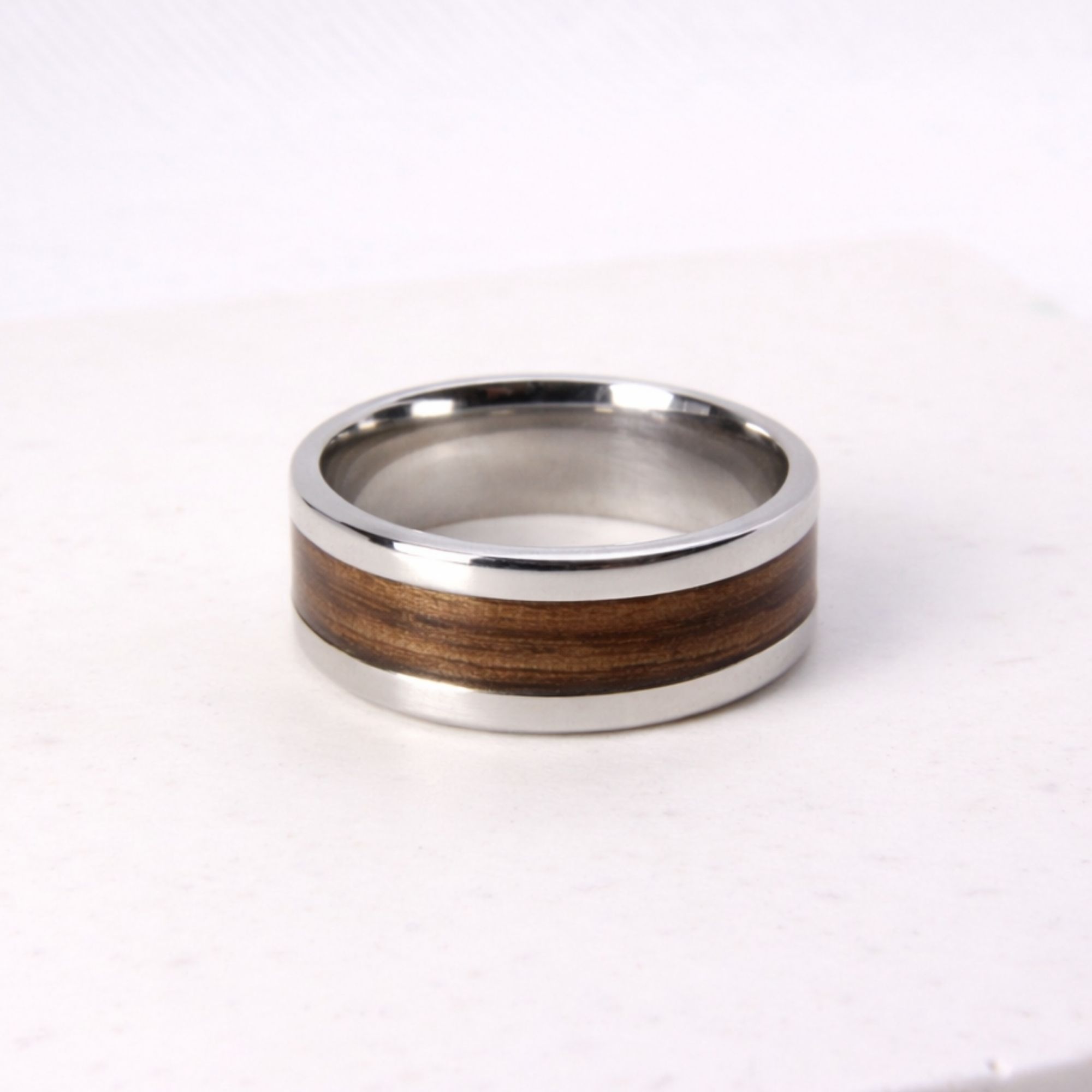 Stainless steel ring with zebrano wood inlay.