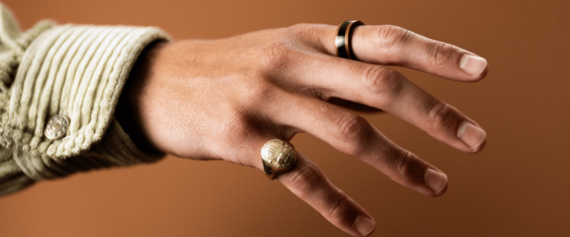 Solid brass scarab signet ring with engraved beetle detail.