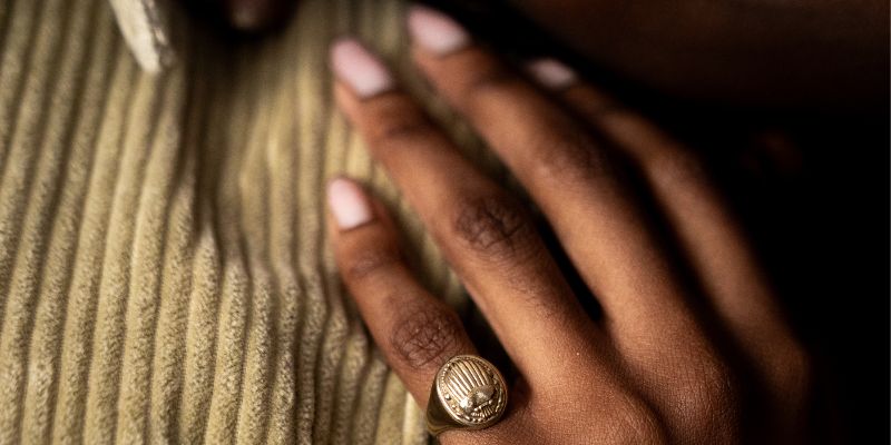 Solid brass scarab signet ring with engraved beetle detail.