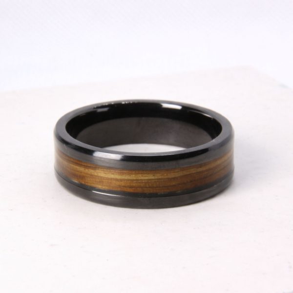Black zirconium ring with zebrano wood inlay.