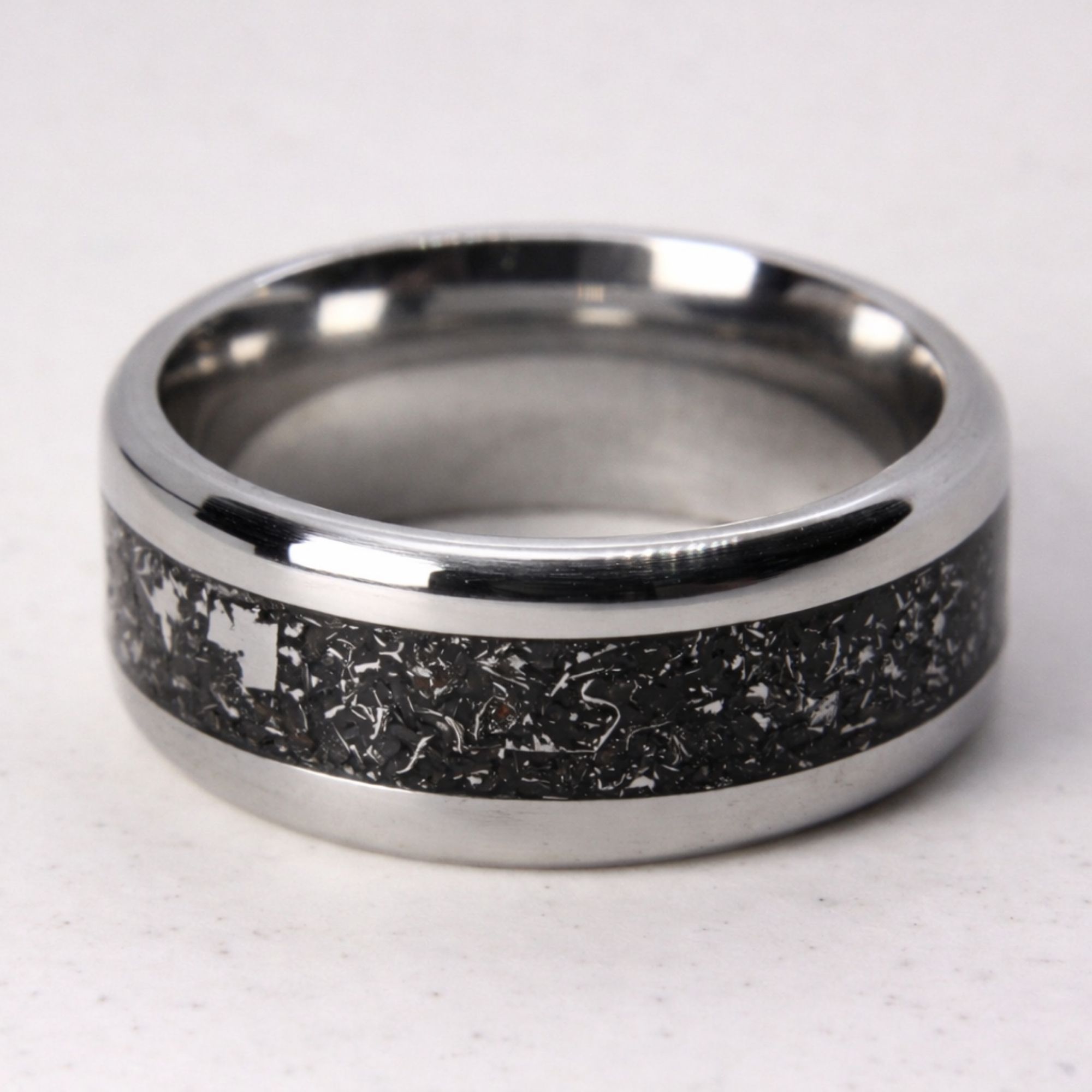 Stainless steel ring with meteorite inlay.