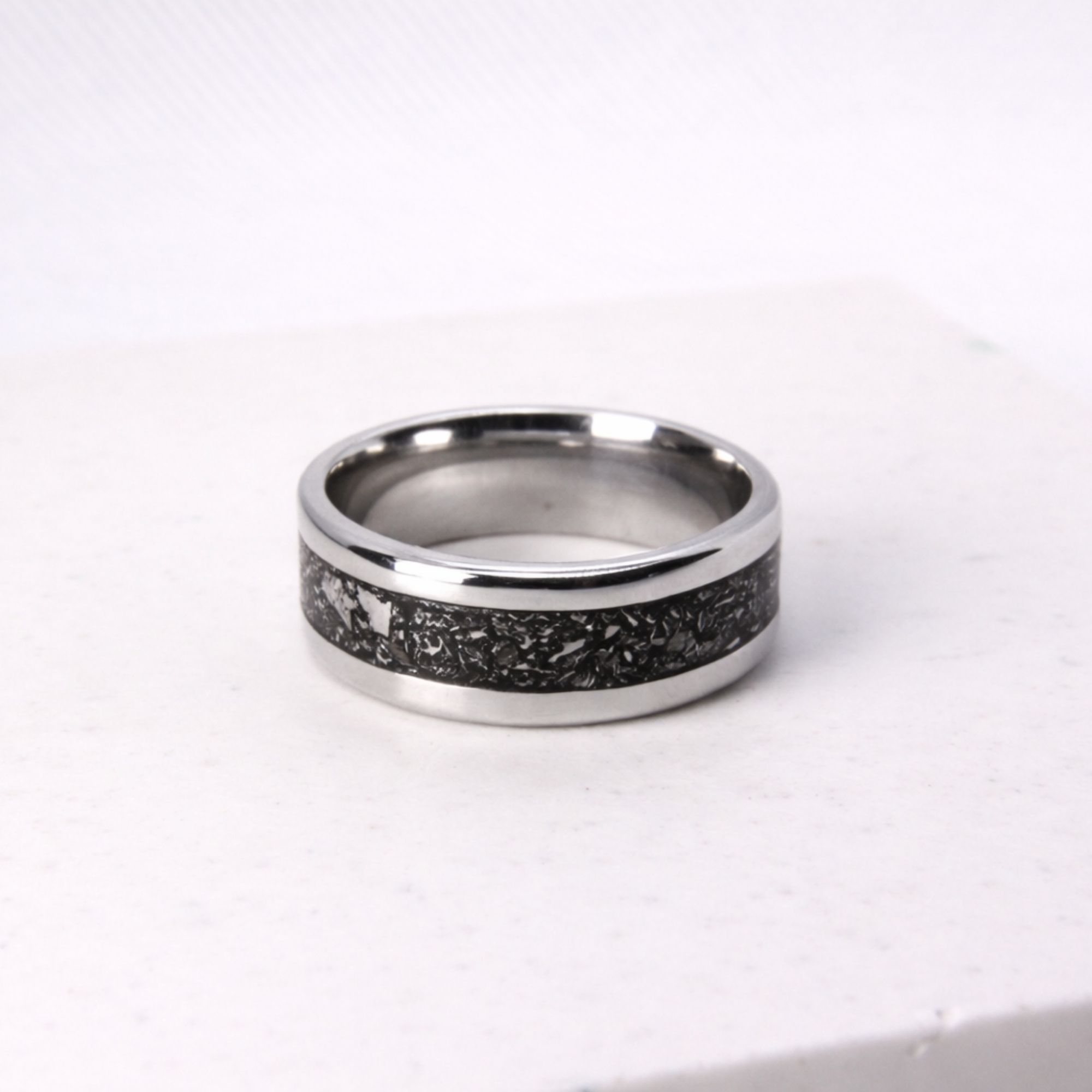 Stainless steel ring with meteorite inlay.