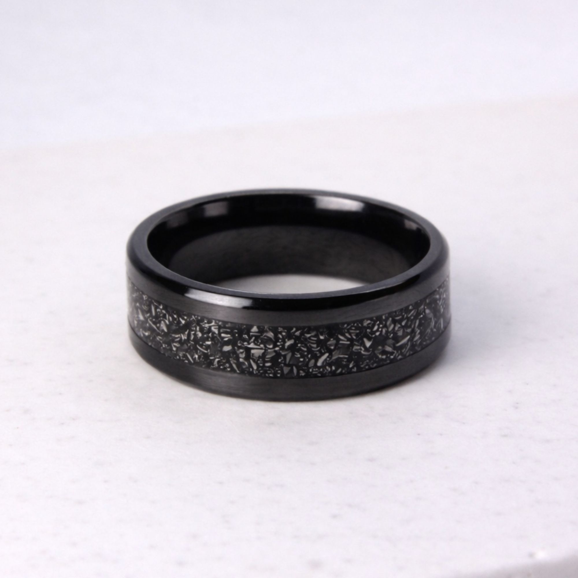 Black zirconium ring with meteorite inlay.