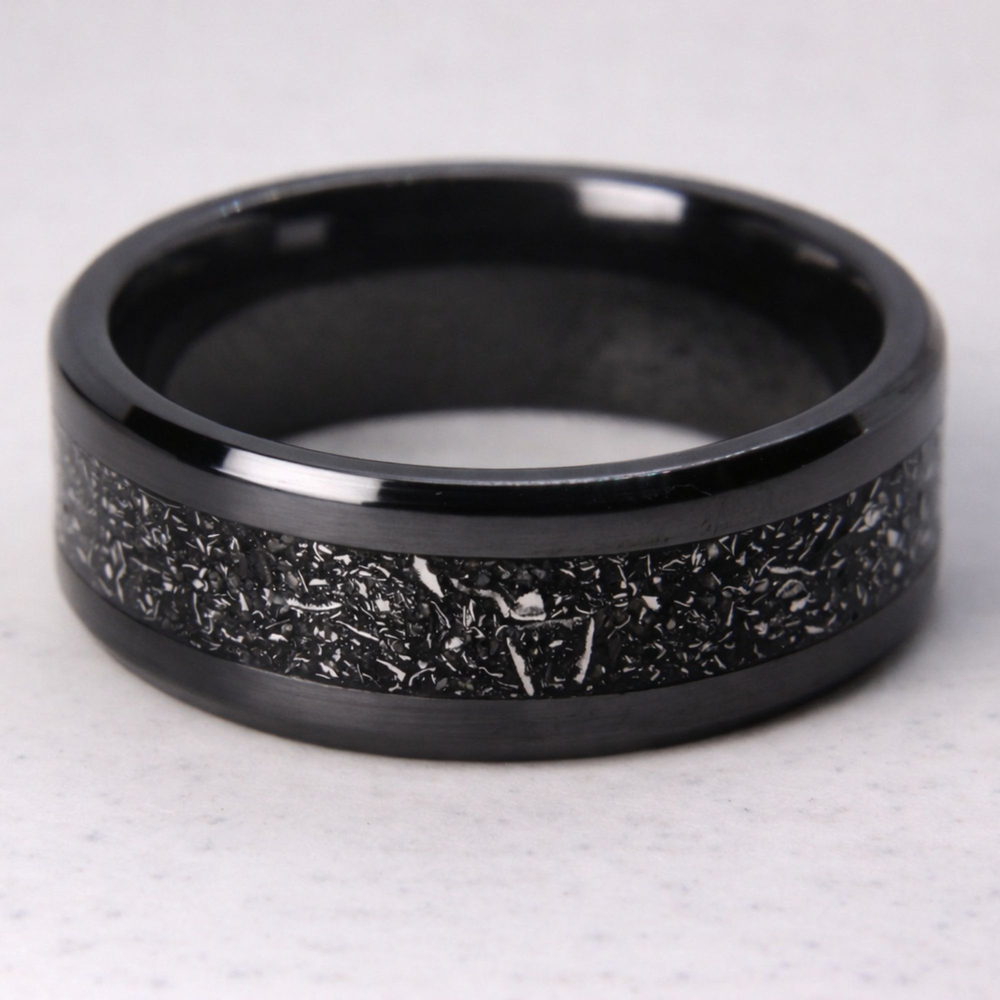Black zirconium ring with meteorite inlay.