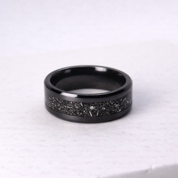Black zirconium ring with meteorite inlay.