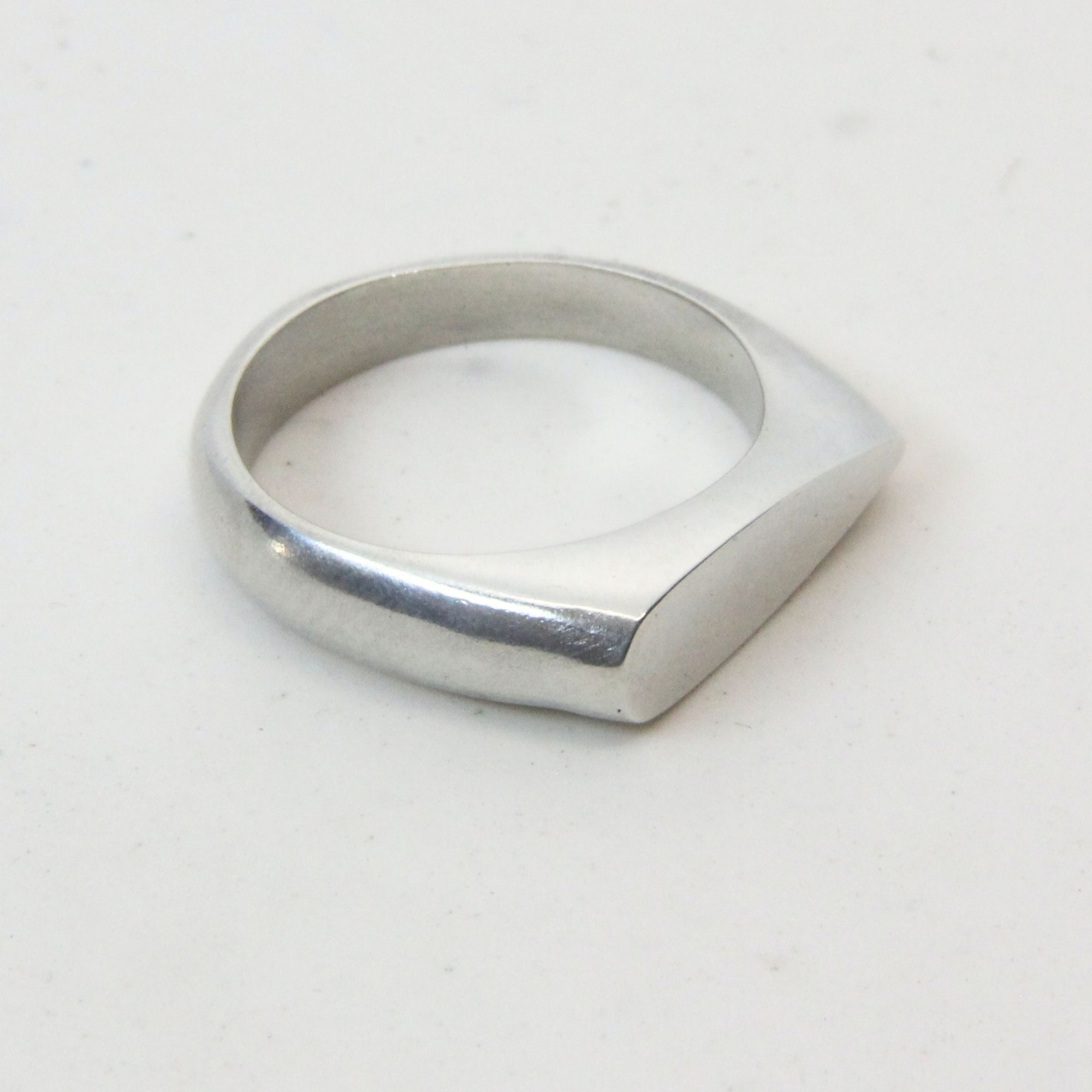 Sterling silver drop shape signet ring.