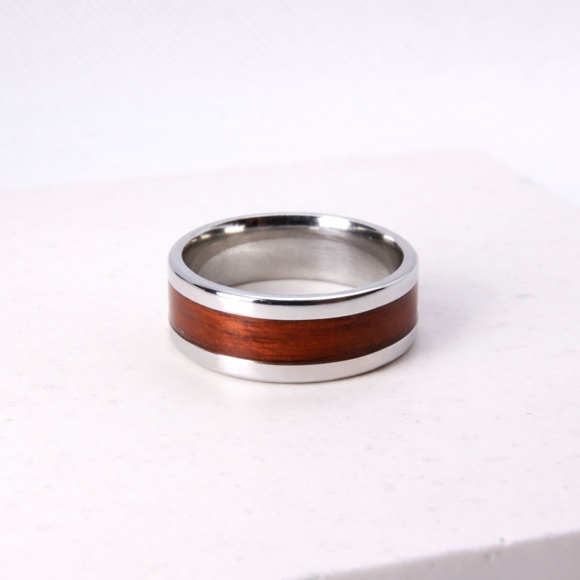 Stainless steel ring with rosewood inlay.