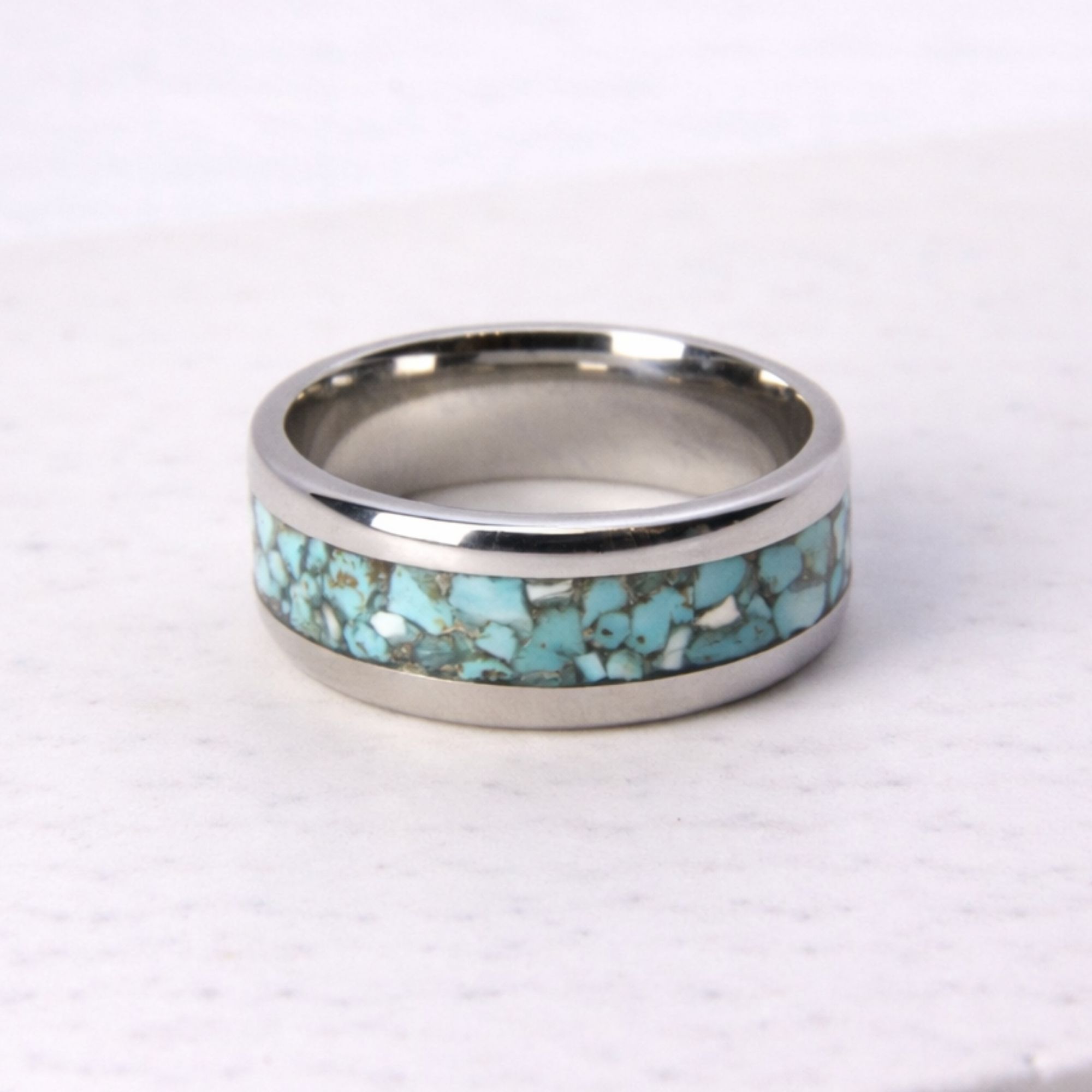 Stainless steel ring with turquoise stone inlay.