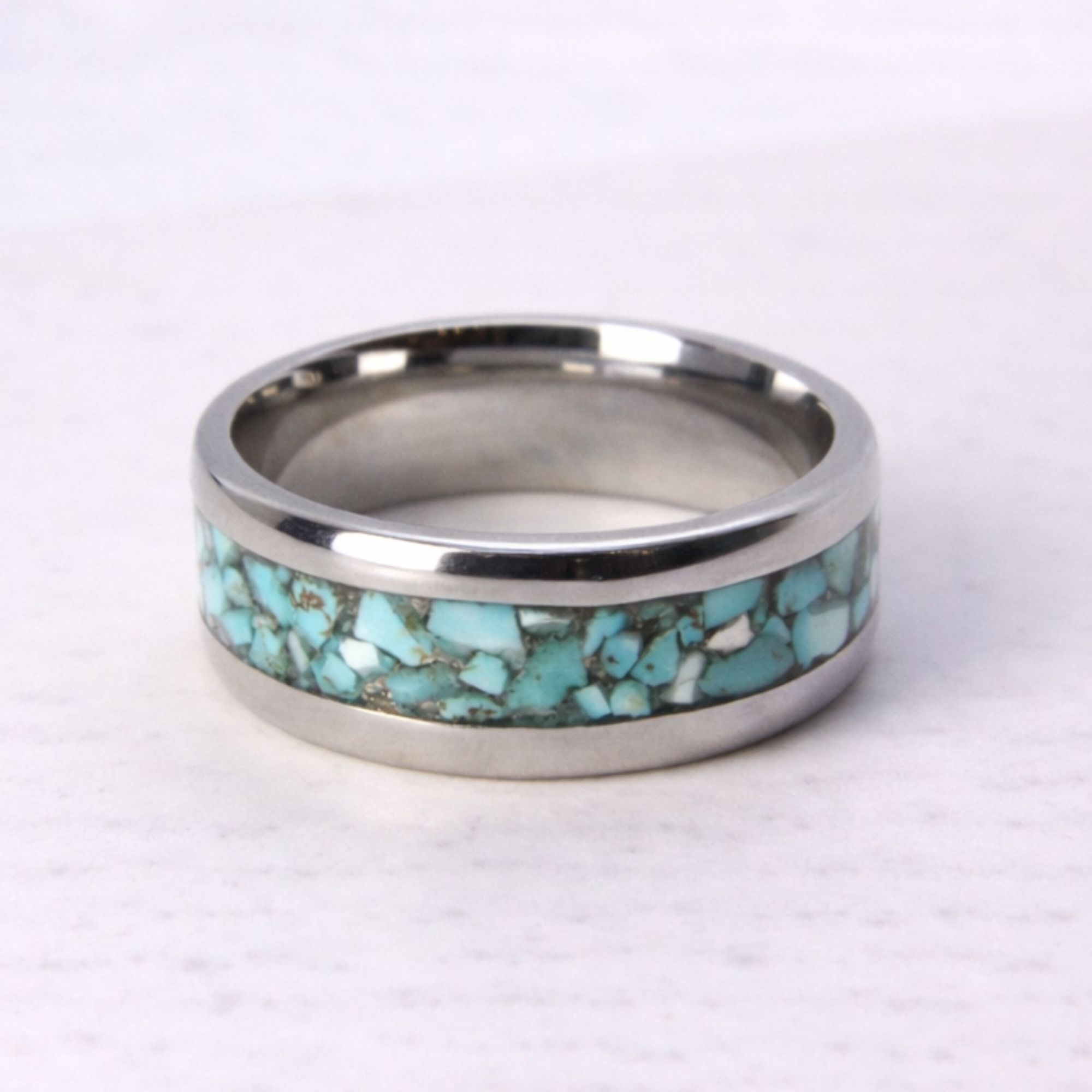 Stainless steel ring with turquoise stone inlay.