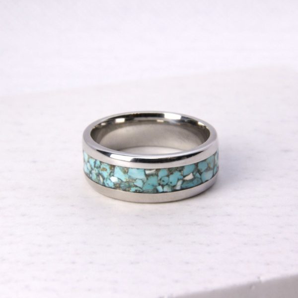 Stainless steel ring with turquoise stone inlay.
