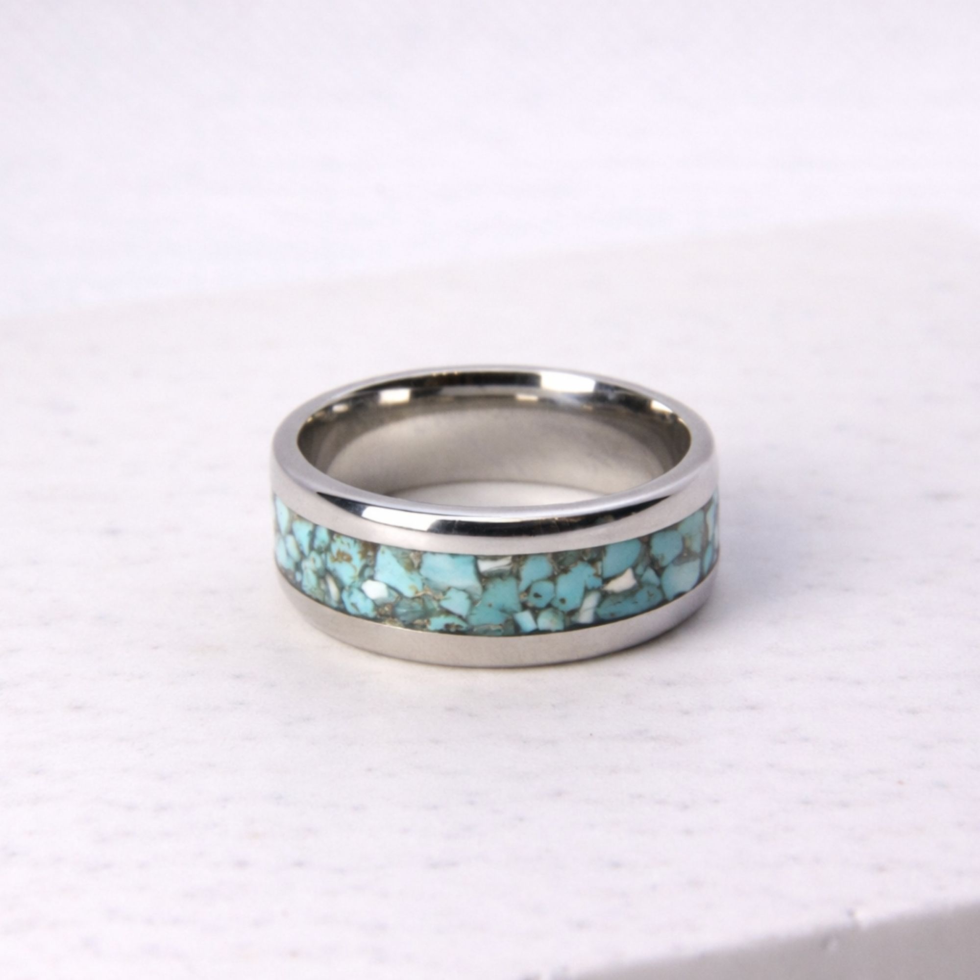 Stainless steel ring with turquoise stone inlay.