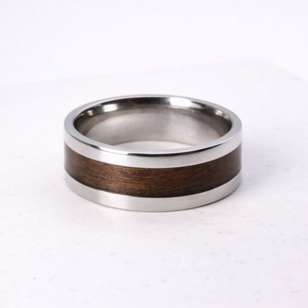Stainless steel ring with walnut wood inlay.
