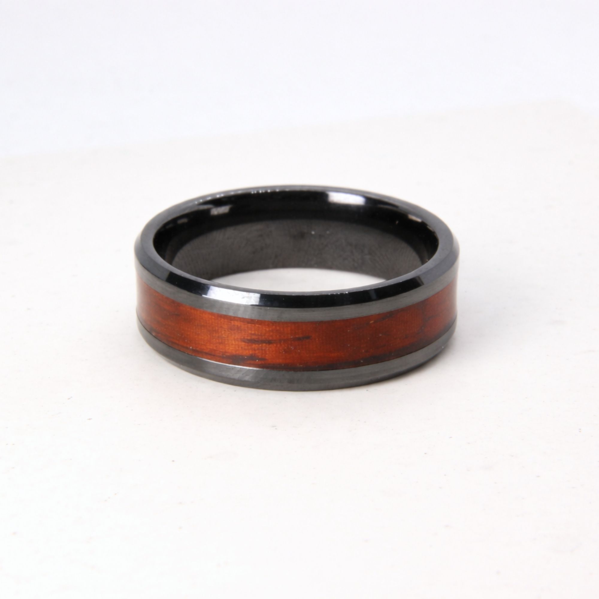 Black zirconium ring with rosewood inlay.
